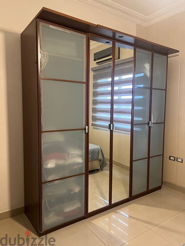 brown/grey closet with mirrors 0