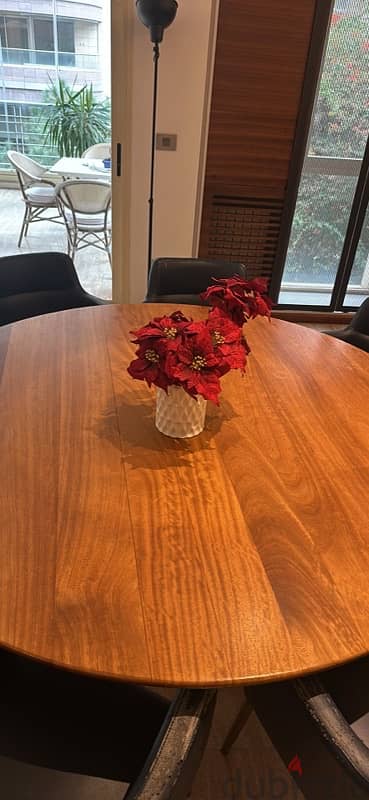 round wooden dining table with 8 chairs 1