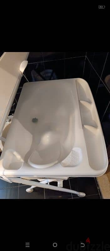 "Cam" bath tub and changing station