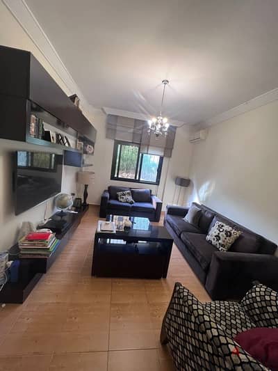 living room with tv unit center table and carpet