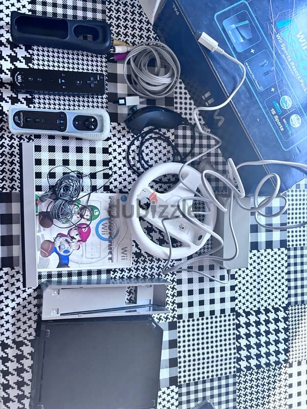 nitendo wii with 2 consoles steering wheel 1