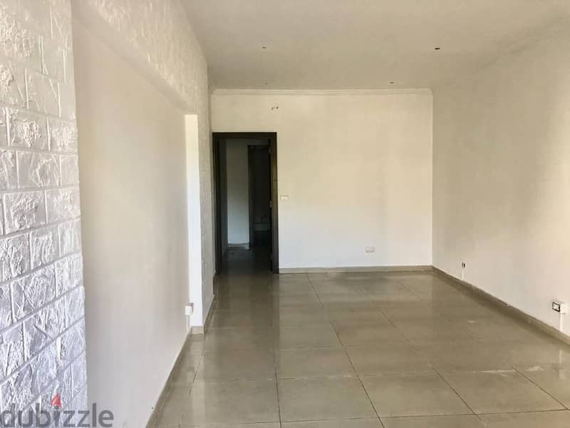 56 Sqm | Prime Location Shop For Rent In Jouret El Ballout 0