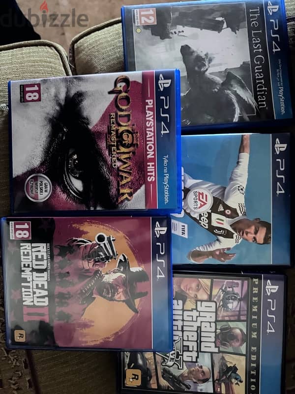 PS4 used like new 500gb + 2 original controller +5cd games gift 1