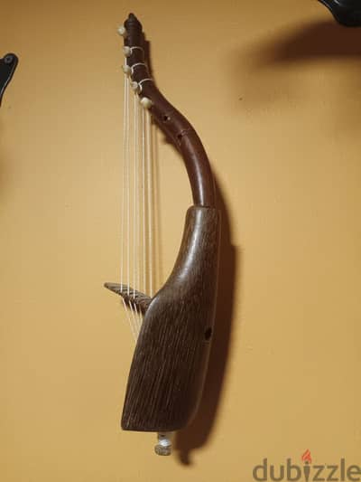 Vintage Agundu arched harp from Uganda