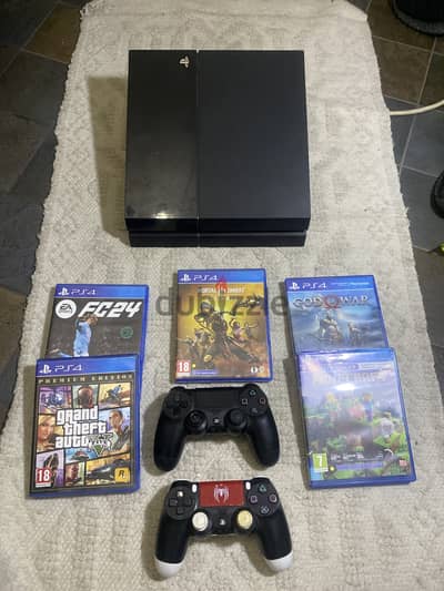 Playstation 4 500gb with 5 games and 2 controllers good condition