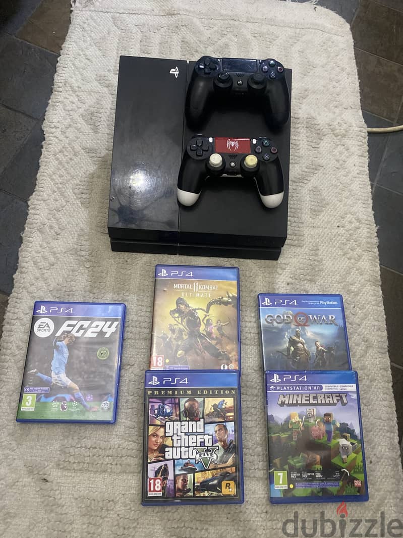 Playstation 4 500gb with 5 games and 2 controllers good condition 1