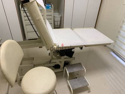 exam table with chair and cabinet for surgery