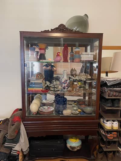 Antique wooden vitrine with mirror and glass