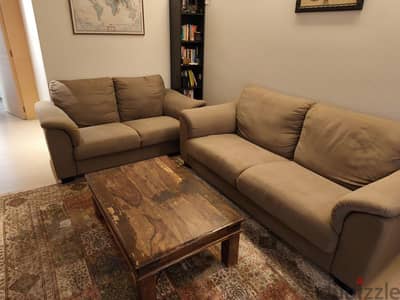 a pair of brown sofas