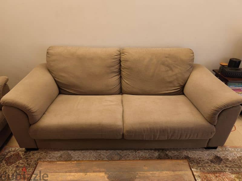 a pair of brown sofas 2