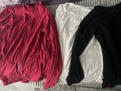 12 shirts  and 3 used like new gym sports shirts and pants size small