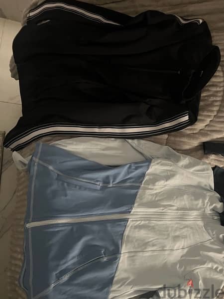 12 shirts  and 3 used like new gym sports shirts and pants size small 3