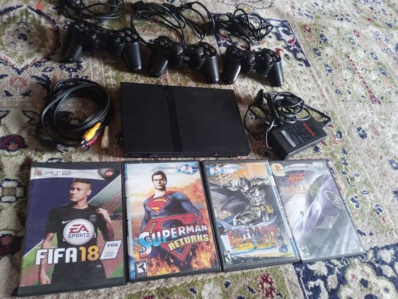 PS2  كامله مع 3 مسكات مع وصلاتها مع 20 سيدي 0