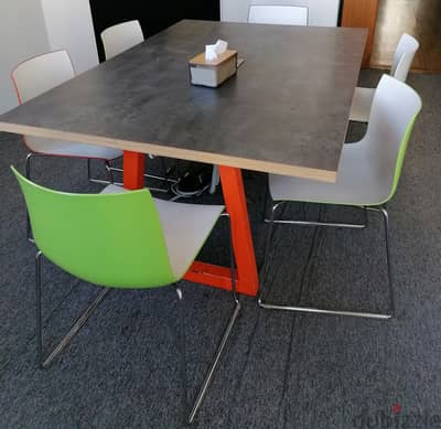 Wooden meeting-room table with chairs