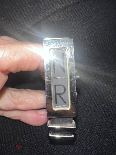 Nina Ricci stainless and rubber band