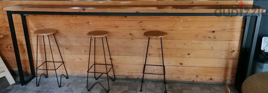 Brown wooden stool on Black metal base