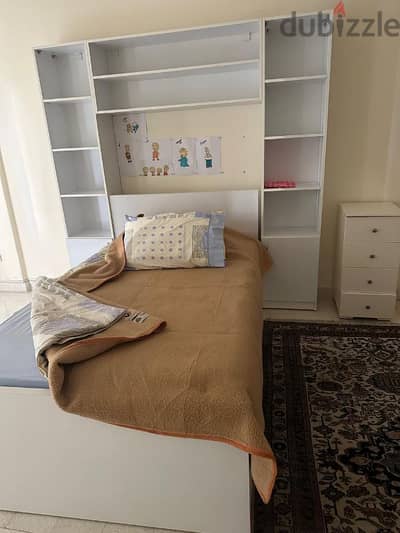 Bed with shelves