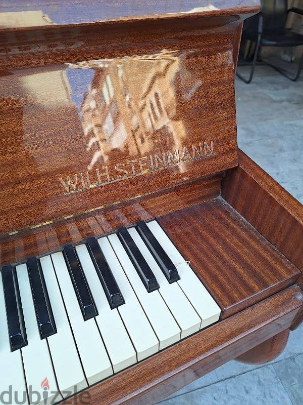 piano with. Steinmann Germany like new tuning warranty 2