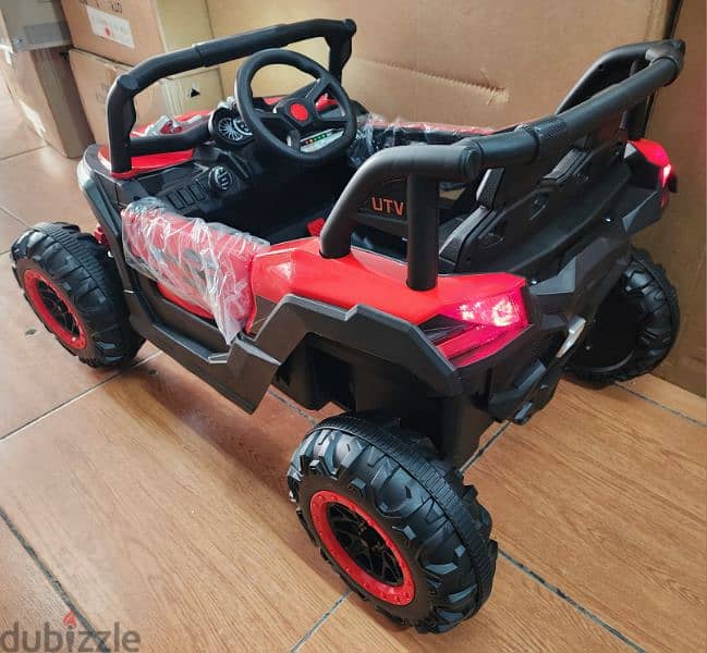 utv polaris 12volt. 2 motors . big battery. remote control. seat belt. 4