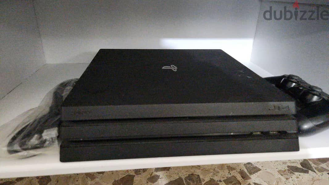 PS4 Pro used like new with multiple games for sale 0