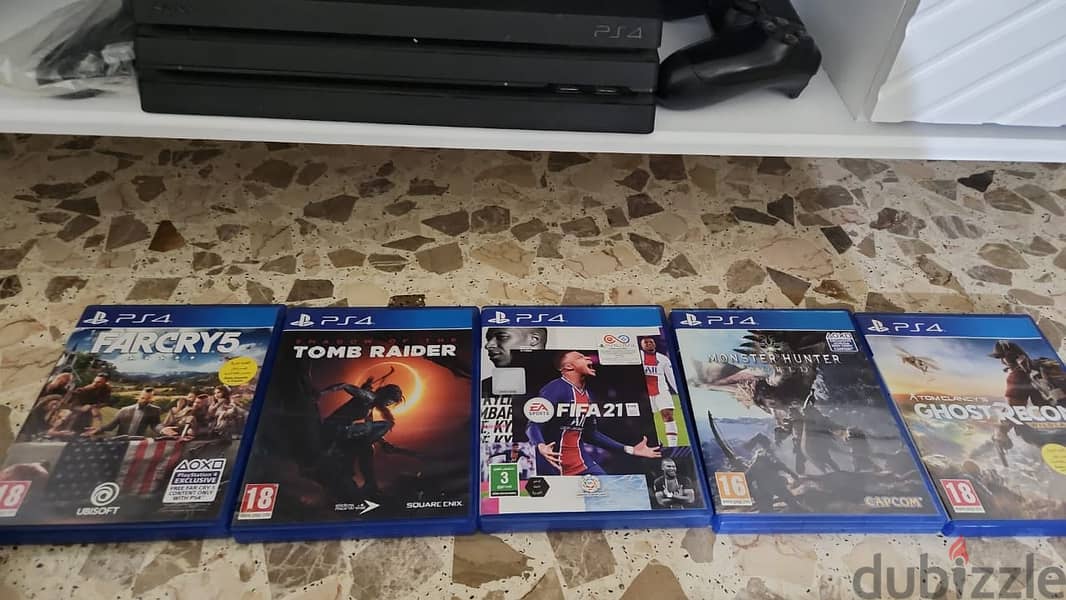 PS4 Pro used like new with multiple games for sale 2