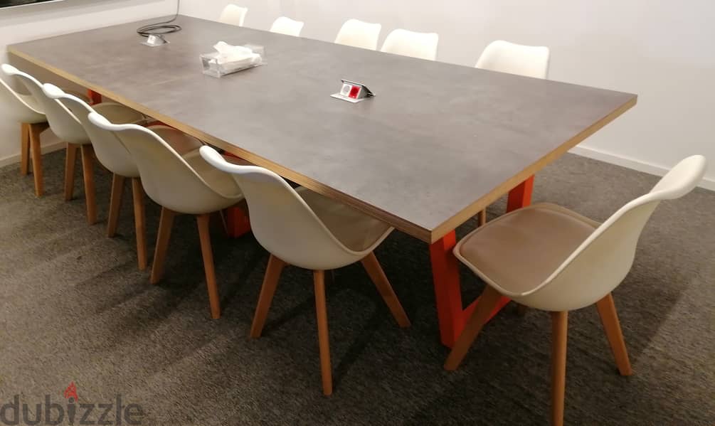 Brown wooden table on colored metal base 0