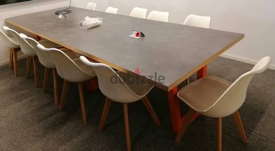 Brown wooden table on colored metal base