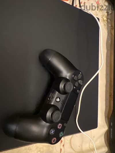 ps4 and a controller and a charger