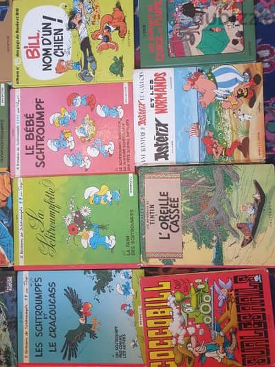 31 livres bandes dessinees,tintin,spirou,asterix, schtroumph,boule bil