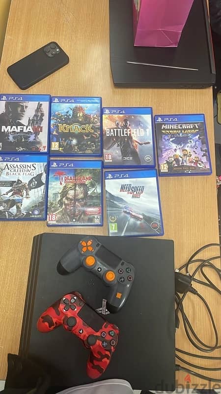 PS4 pro 1TB, 8 games and 2 controllers 0