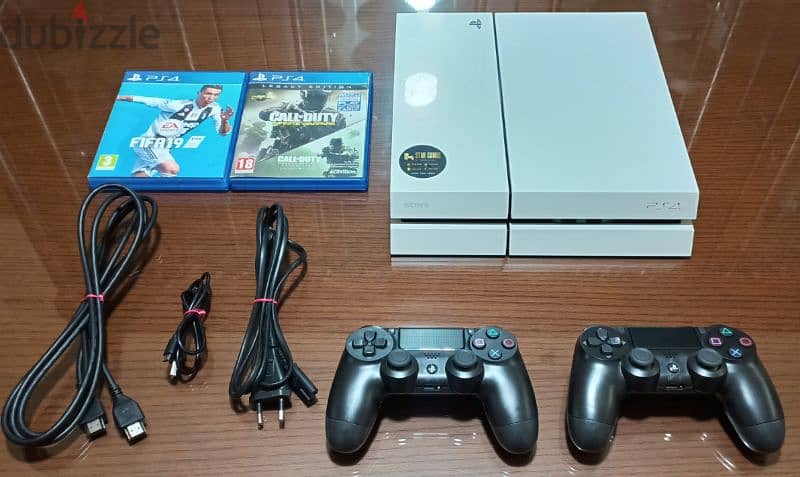 playstation 4 European 2 controller and 2 games all cables 0