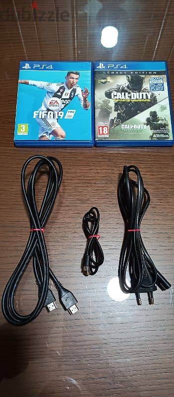 playstation 4 European 2 controller and 2 games all cables 4