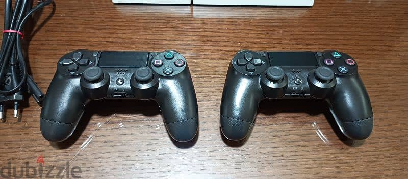 playstation 4 European 2 controller and 2 games all cables 5