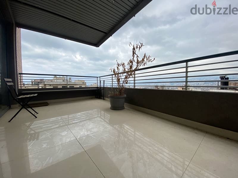 Furnished modern apartment for sale with open views in Achrafieh. 0