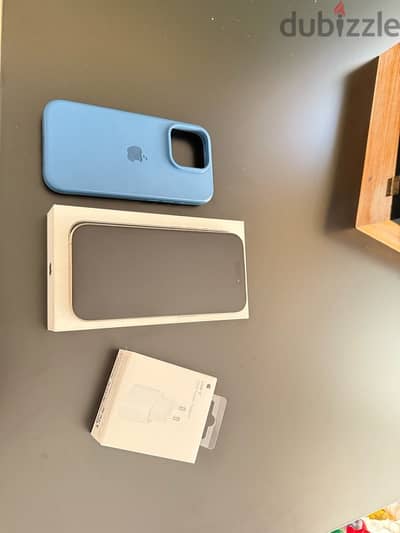 iphone 15 pro natural titanium with original charge and box 0 scratch