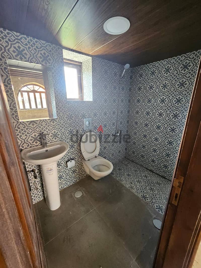 Land with a Stone House for sale in Batroun - أرض مع منزل حجري للبيع ف 8