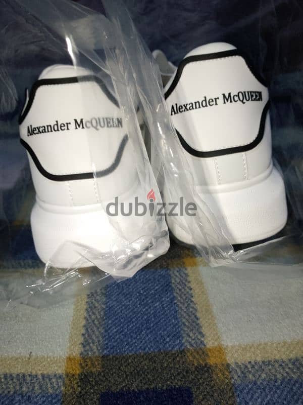 Alexander McQueen white shoes. 5