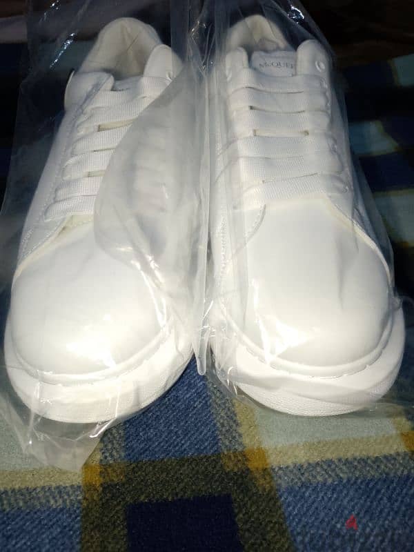 Alexander McQueen white shoes. 6