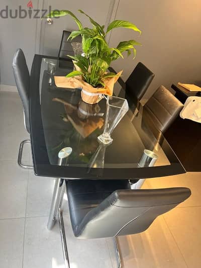 Glass and Stainless Steel Table with Leather Chairs