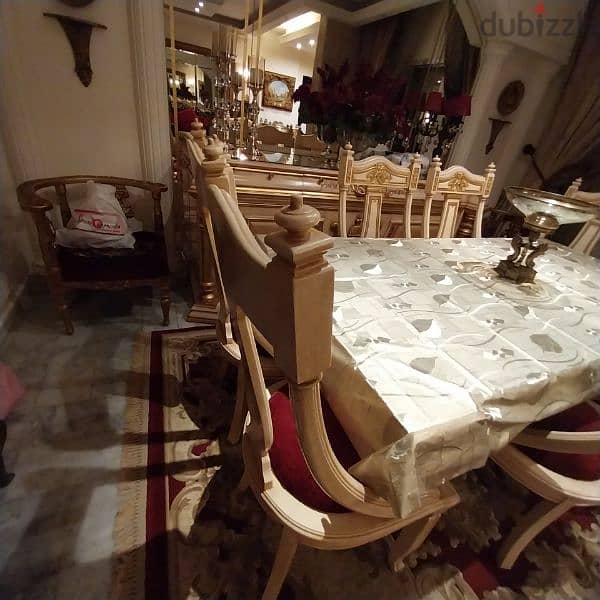 A full  dining room BRAND NEW.    a closet and a set of 8 chairs 6