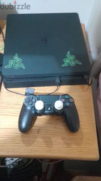 ps4 slim used with 2 controller and 14 games for whats 03127771