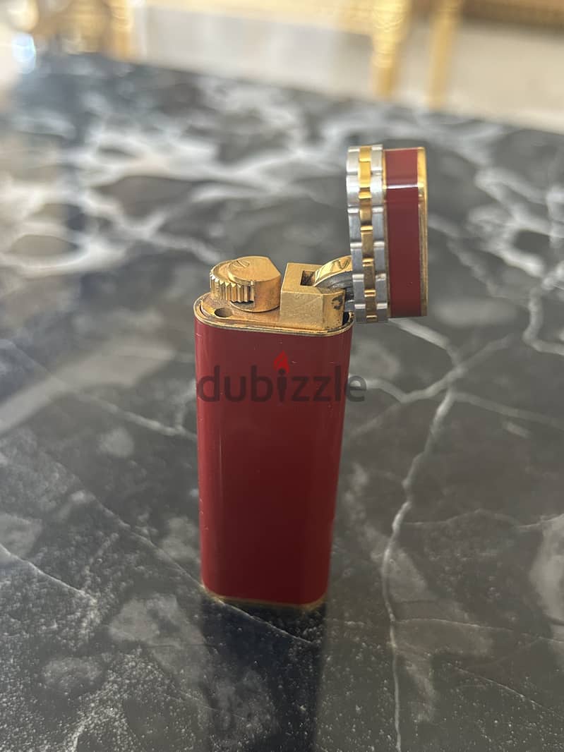 A 18K gold and red laque lighter, Cartier, with box 2