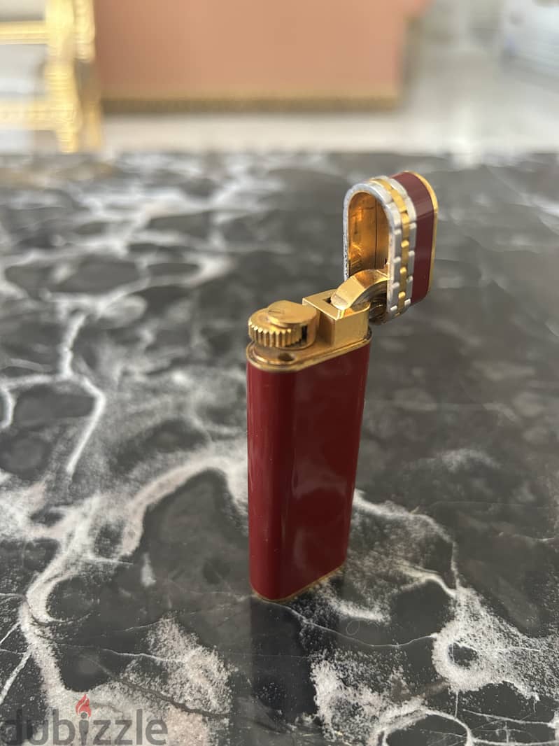 A 18K gold and red laque lighter, Cartier, with box 3