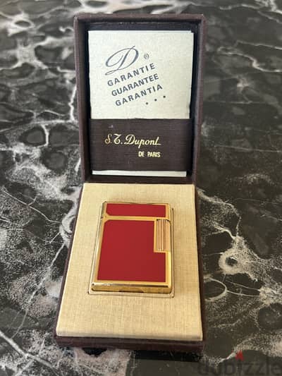 S. T. Dupont red lacquer and plated gold lighter collection