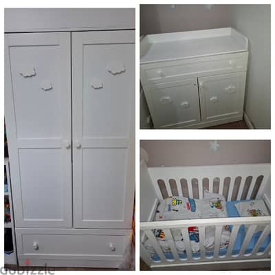 Bed, white baby dresser with changing table, and wardrobe.