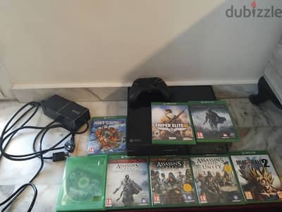 Xbox One with 8 game discs and 1 controller