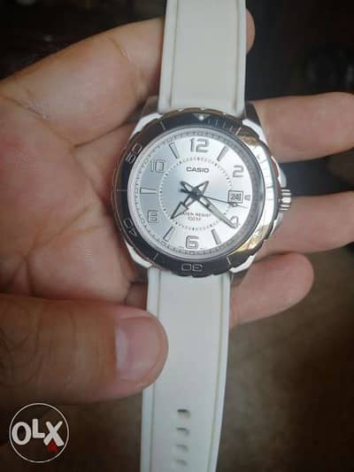 Casio analog white stainless steel.