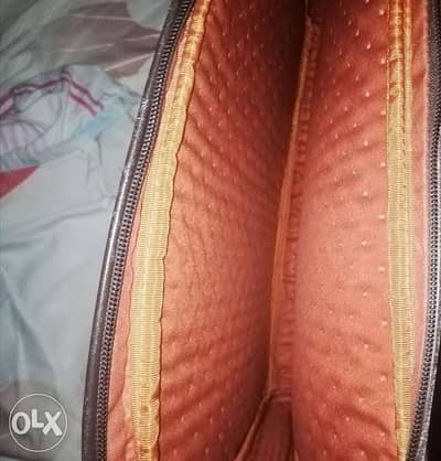 Authentic TUMI laptop bag orange interior like new/شنطه لابتوب تومي