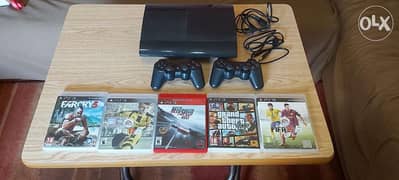 PS3 slim with five games and 2 controllers in perfect condition
