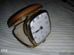 ساعة منبه صغير قديم تعبايه يتحول الى علبه صغيرة يعمل جيدا صنع اليابان 0